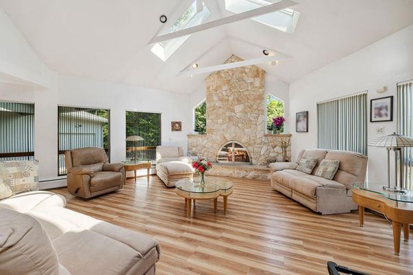 Fireplace, Interior, Living room, Recessed Lighting, Stone Walls, Wood Texture Flooring