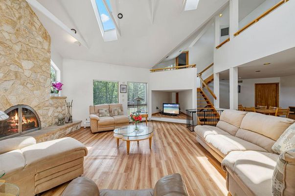 Fireplace, Interior, Living room, Recessed Lighting, Stone Walls, Wood Texture Flooring