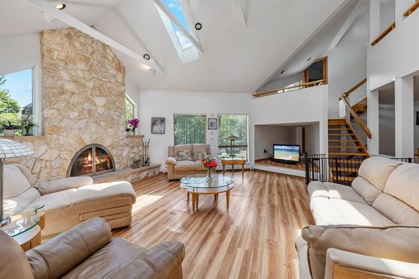 Fireplace, Interior, Living room, Recessed Lighting, Stone Walls, Wood Texture Flooring