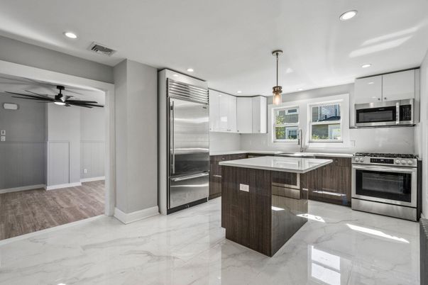 Interior, Kitchen, Marble, Pendant Lights, Recessed Lighting, Stainless Steel Appliances, Wood Texture Flooring