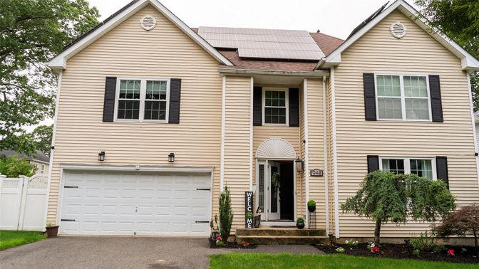 Attached, Exterior, Facade, Solar Panels, Rowhouse