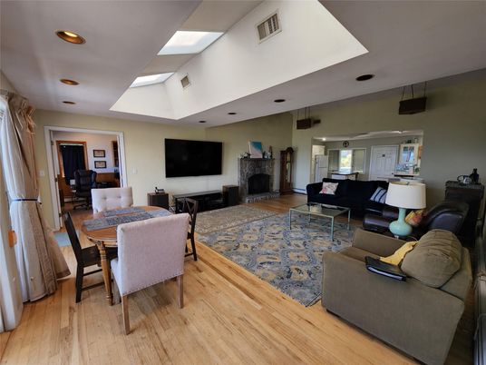 Dining room, Fireplace, Interior, Living room, Recessed Lighting, Wood Texture Flooring