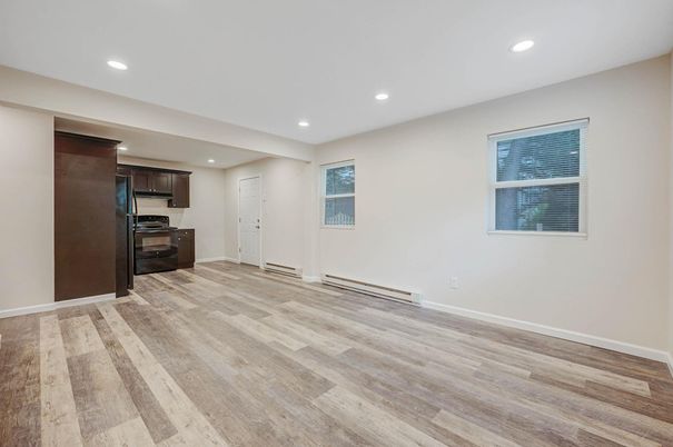 Empty room, Interior, Kitchen, Recessed Lighting, Stainless Steel Appliances, Wood Texture Flooring