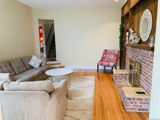 Fireplace, Interior, Living room, Recessed Lighting, Stone Walls, Wood Texture Flooring