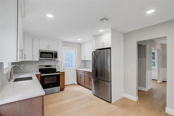Interior, Kitchen, Recessed Lighting, Stainless Steel Appliances, Wood Texture Flooring