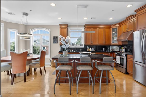Dining room, Interior, Kitchen, Pendant Lights, Recessed Lighting, Stainless Steel Appliances, Wood Texture Flooring