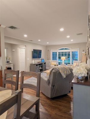 Fireplace, Interior, Living room, Recessed Lighting, Water, Wood Texture Flooring