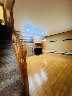 Fireplace, Interior, Recessed Lighting, Stone Walls, Wood Texture Flooring