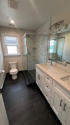 Bathroom, Dual Sink Vanities, Glass Shower, Interior, Marble Walls, Recessed Lighting