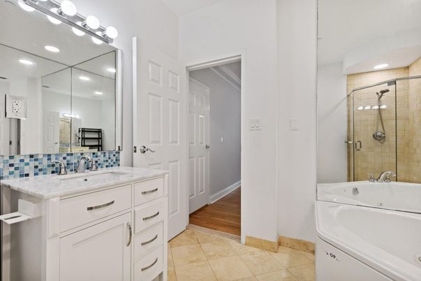 Bathroom, Dual Sink Vanities, Glass Shower, Interior, Recessed Lighting, Wood Texture Flooring