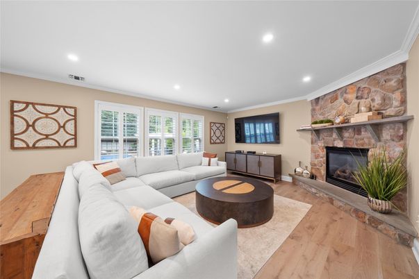 Fireplace, Interior, Living room, Recessed Lighting, Stone Walls, Wood Texture Flooring