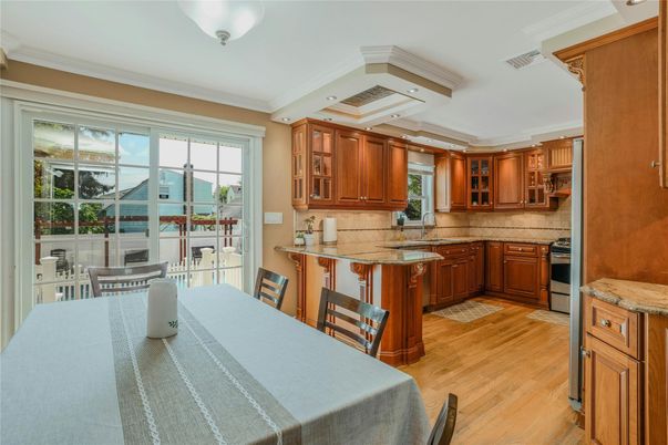 Dining room, Interior, Kitchen, Recessed Lighting, Stainless Steel Appliances, Wood Texture Flooring