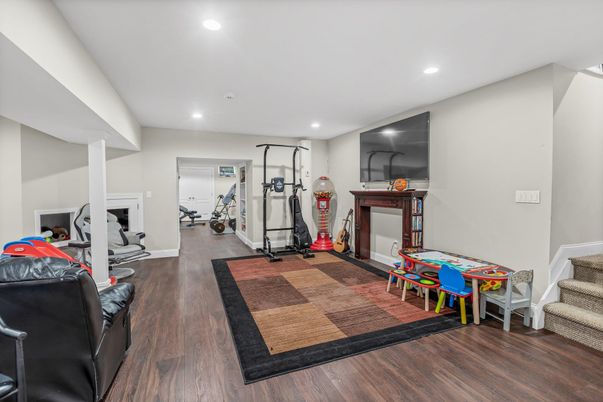 Fireplace, Fitness Equipment, Interior, Recessed Lighting, Wood Texture Flooring