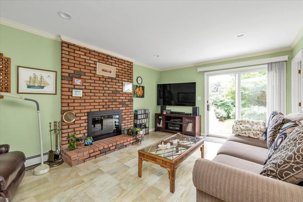 Fireplace, Interior, Living room, Recessed Lighting, Stone Walls, Wood Texture Flooring