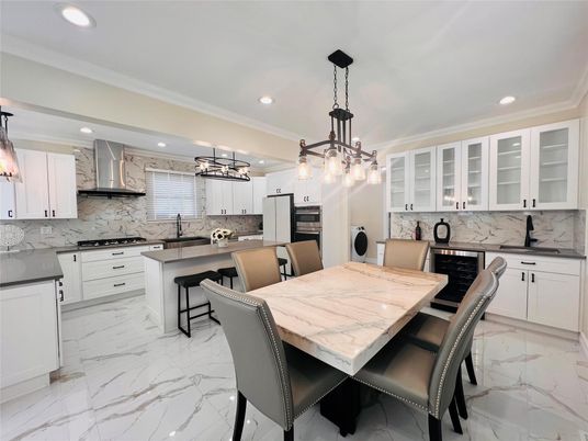 Dining room, Interior, Kitchen, Marble, Marble Walls, Pendant Lights, Recessed Lighting, Stainless Steel Appliances