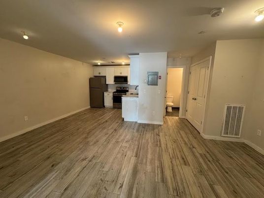 Empty room, Interior, Kitchen, Stainless Steel Appliances, Wood Texture Flooring