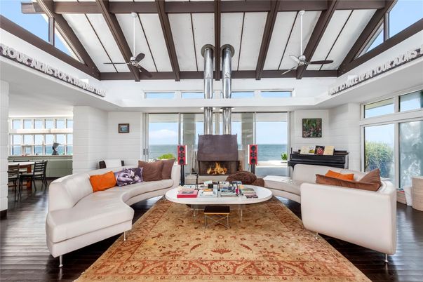 Dining room, Fireplace, Interior, Living room, Pendant Lights, Water, Wooden Beams, Wood Texture Flooring