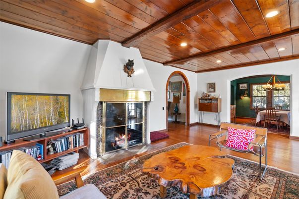 Chandelier, Dining room, Fireplace, Interior, Living room, Recessed Lighting, Wooden Beams, Wooden Ceilings, Wood Texture Flooring