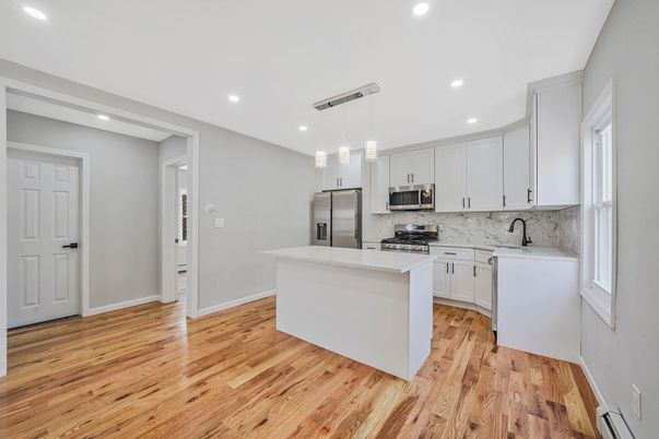 Interior, Kitchen, Pendant Lights, Recessed Lighting, Stainless Steel Appliances, Wood Texture Flooring