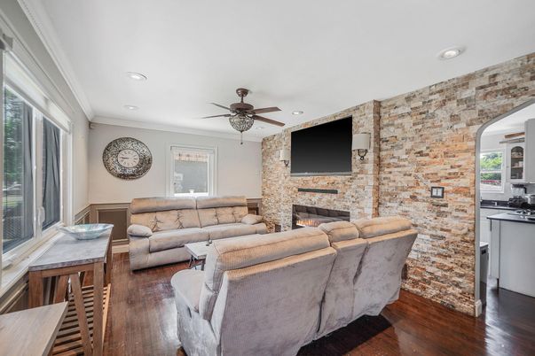 Fireplace, Interior, Living room, Recessed Lighting, Stone Walls, Wood Texture Flooring
