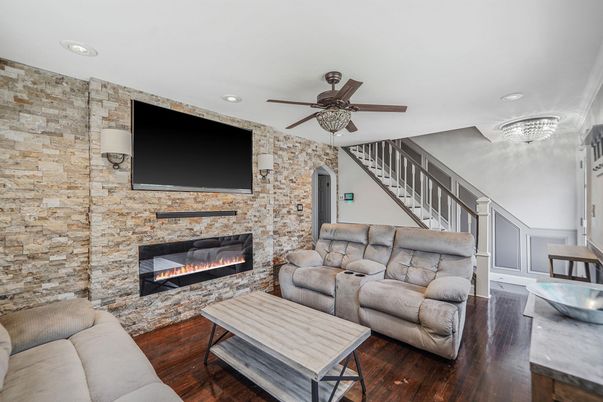 Fireplace, Interior, Living room, Recessed Lighting, Stone Walls, Wood Texture Flooring