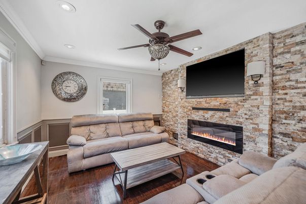 Fireplace, Interior, Living room, Recessed Lighting, Stone Walls, Wood Texture Flooring