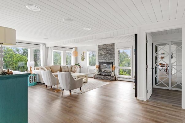 Fireplace, Interior, Living room, Recessed Lighting, Stone Walls, Wood Texture Flooring