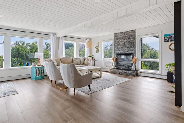 Fireplace, Interior, Living room, Recessed Lighting, Stone Walls, Wood Texture Flooring
