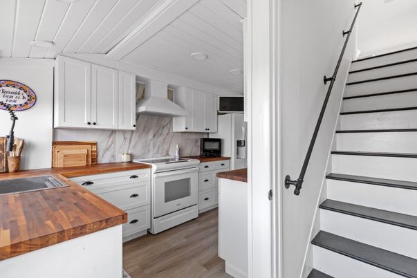 Interior, Kitchen, Marble Walls, Stainless Steel Appliances, Wood Texture Flooring