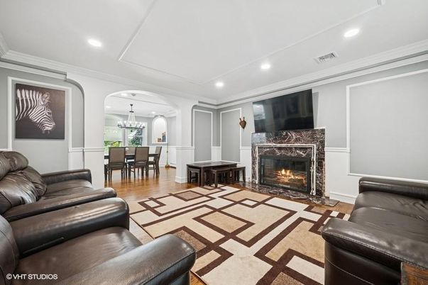 Chandelier, Dining room, Fireplace, Interior, Living room, Recessed Lighting, Wood Texture Flooring