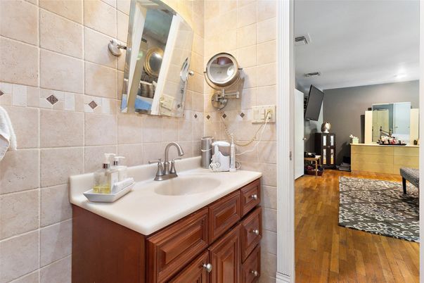 Bathroom, Dual Sink Vanities, Interior, Recessed Lighting, Wood Texture Flooring
