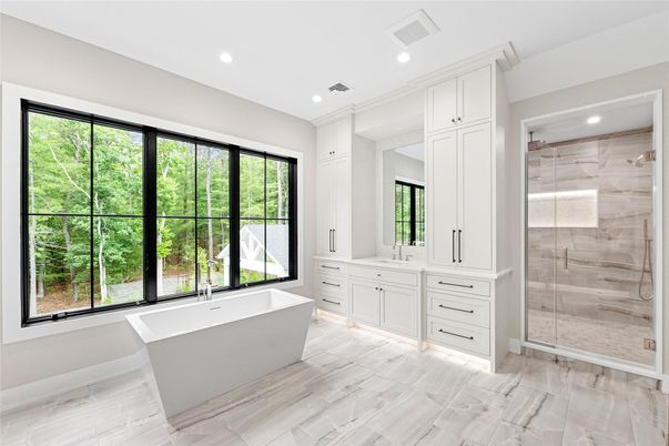 Bathroom, Dual Sink Vanities, Free Standing Baths, Glass Shower, Interior, Recessed Lighting, Wood Texture Flooring