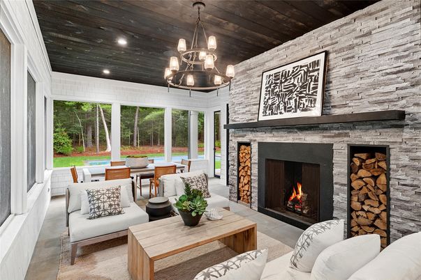Chandelier, Dining room, Fireplace, Interior, Living room, Pendant Lights, Recessed Lighting, Stone Walls, Wooden Ceilings