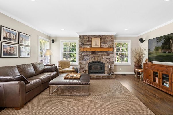 Fireplace, Interior, Living room, Recessed Lighting, Stone Walls, Wood Texture Flooring