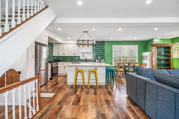 Chandelier, Dining room, Interior, Kitchen, Living room, Recessed Lighting, Stainless Steel Appliances, Wood Texture Flooring