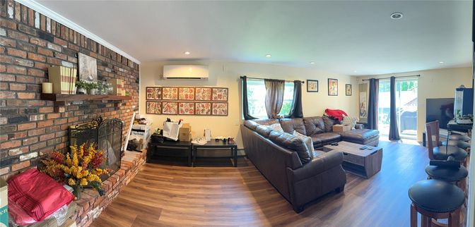 Fireplace, Interior, Living room, Recessed Lighting, Stone Walls, Wood Texture Flooring