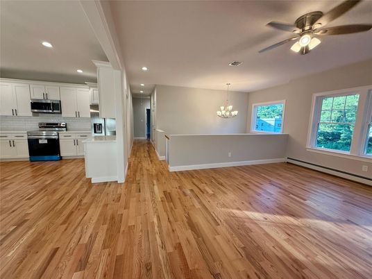Chandelier, Empty room, Interior, Kitchen, Recessed Lighting, Stainless Steel Appliances, Wood Texture Flooring