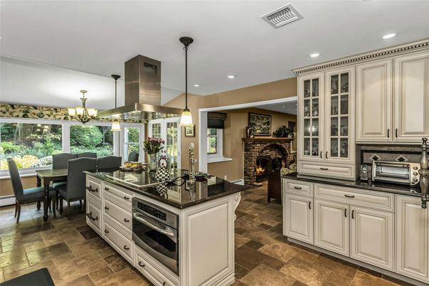 Chandelier, Dining room, Fireplace, Interior, Kitchen, Pendant Lights, Recessed Lighting, Stainless Steel Appliances