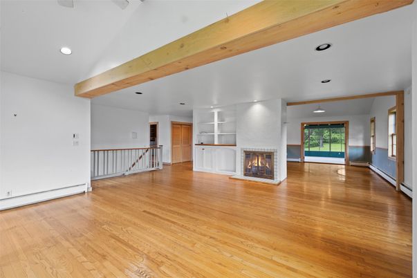 Empty room, Fireplace, Interior, Recessed Lighting, Wooden Beams, Wood Texture Flooring