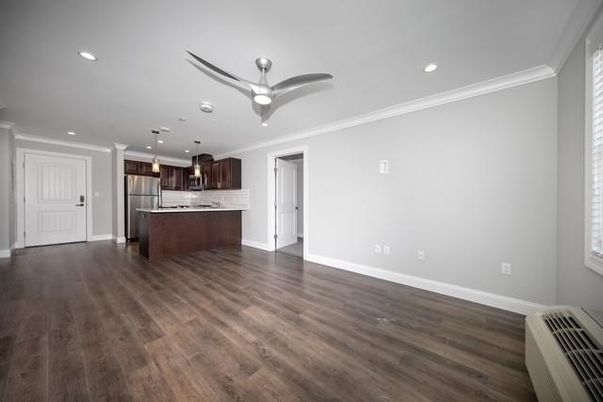Empty room, Interior, Kitchen, Pendant Lights, Recessed Lighting, Stainless Steel Appliances, Wood Texture Flooring