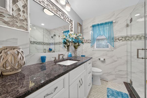 Bathroom, Dual Sink Vanities, Glass Shower, Interior, Marble Walls, Recessed Lighting
