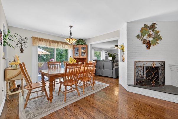Dining room, Fireplace, Interior, Pendant Lights, Stone Walls, Wood Texture Flooring