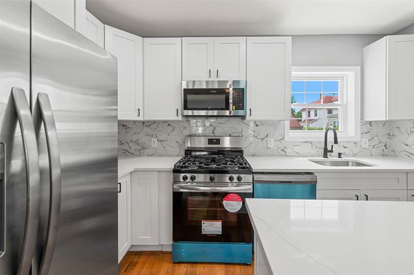 Interior, Kitchen, Marble Walls, Stainless Steel Appliances, Wood Texture Flooring