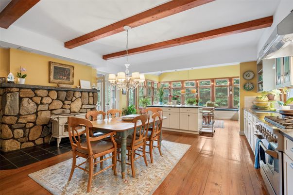 Chandelier, Dining room, Fireplace, Interior, Stone Walls, Wooden Beams, Wood Texture Flooring