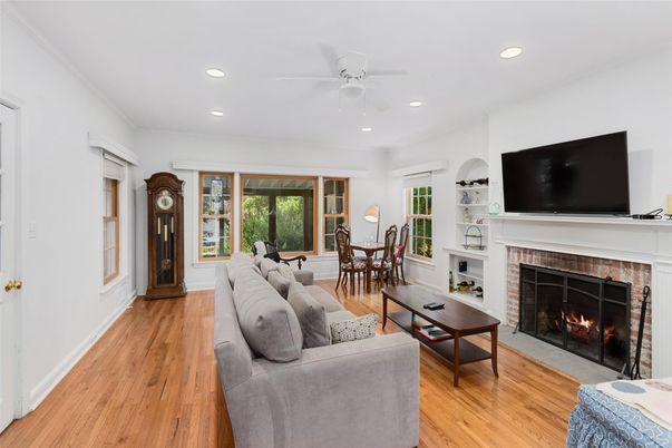Dining room, Fireplace, Interior, Living room, Recessed Lighting, Wood Texture Flooring