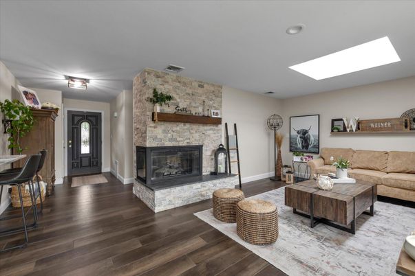 Fireplace, Interior, Living room, Recessed Lighting, Stone Walls, Wood Texture Flooring