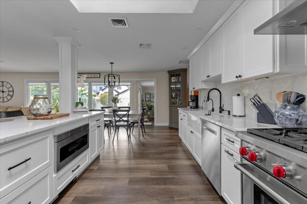 Dining room, Interior, Kitchen, Pendant Lights, Recessed Lighting, Stainless Steel Appliances, Wood Texture Flooring