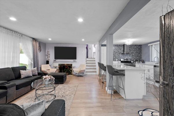 Chandelier, Fireplace, Interior, Kitchen, Living room, Recessed Lighting, Wood Texture Flooring