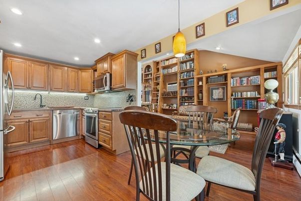 Dining room, Interior, Kitchen, Pendant Lights, Recessed Lighting, Stainless Steel Appliances, Wood Texture Flooring