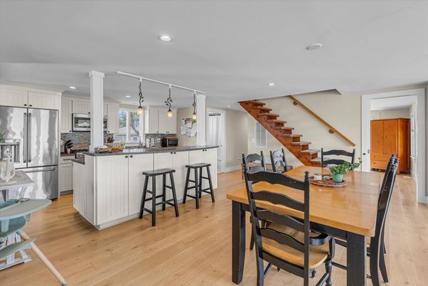 Dining room, Interior, Kitchen, Pendant Lights, Recessed Lighting, Stainless Steel Appliances, Wood Texture Flooring